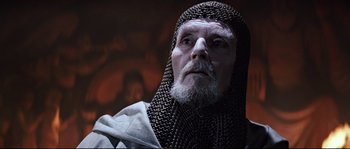Movie still from “Indiana Jones and the Last Crusade” (1989), directed by Steven Spielberg – An old man dressed as a medieval knight; Close Up shot, Low angle