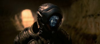 Movie still from “Lost in Space” (2018), created by Irwin Allen – A man in a space suit is looking at the camera; Close Up shot, Low angle