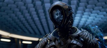 Movie still from “Lost in Space” (2018), created by Irwin Allen – A person in a suit with a helmet on; Close Up shot, Overhead angle