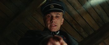 Movie still from “Inglourious Basterds” (2009), directed by Quentin Tarantino – A person wearing a uniform; Close Up shot, Low angle