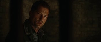 Movie still from “Inglourious Basterds” (2009), directed by Quentin Tarantino – A person wearing a jacket; Close Up shot, Over the shoulder angle