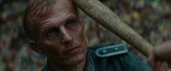 Movie still from “Inglourious Basterds” (2009), directed by Quentin Tarantino – A person holding a baseball bat; Close Up shot, Over the shoulder angle