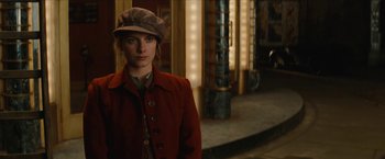 Movie still from “Inglourious Basterds” (2009), directed by Quentin Tarantino – A woman wearing a hat and a red coat; Medium shot, Low angle