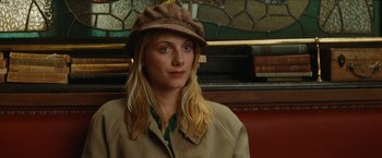Movie still from “Inglourious Basterds” (2009), directed by Quentin Tarantino – A woman wearing a hat and a jacket; Close Up shot, Over the shoulder angle