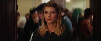 Movie still from “Inglourious Basterds” (2009), directed by Quentin Tarantino – A person with long hair; Close Up shot, Over the shoulder angle