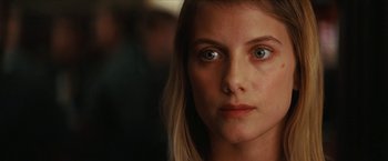 Movie still from “Inglourious Basterds” (2009), directed by Quentin Tarantino – A woman's face in a dark room; Close Up shot, Over the shoulder angle