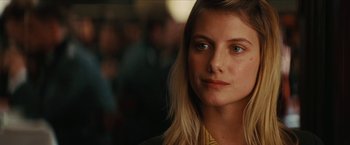 Movie still from “Inglourious Basterds” (2009), directed by Quentin Tarantino – A person with long blonde hair; Close Up shot, Over the shoulder angle