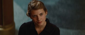 Movie still from “Inglourious Basterds” (2009), directed by Quentin Tarantino – A young woman with blue eyes wearing a black shirt; Close Up shot, Over the shoulder angle