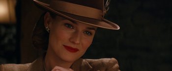 Movie still from “Inglourious Basterds” (2009), directed by Quentin Tarantino – A person wearing a hat; Close Up shot, Over the shoulder angle