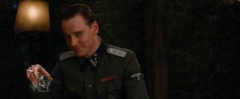 Movie still from “Inglourious Basterds” (2009), directed by Quentin Tarantino – A person wearing a military uniform; Medium shot, Over the shoulder angle