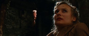 Movie still from “Inglourious Basterds” (2009), directed by Quentin Tarantino – A man and a woman in a dark room; Close Up shot, Low angle
