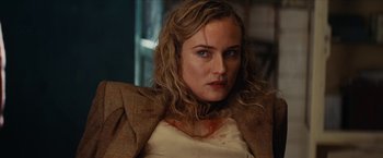 Movie still from “Inglourious Basterds” (2009), directed by Quentin Tarantino – A person wearing a jacket; Close Up shot, Over the shoulder angle