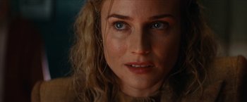 Movie still from “Inglourious Basterds” (2009), directed by Quentin Tarantino – A woman's face with blue eyes; Close Up shot, Over the shoulder angle