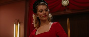 Movie still from “Inglourious Basterds” (2009), directed by Quentin Tarantino – A woman in a red dress with a black veil; Close Up shot, Low angle