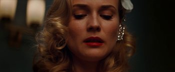 Movie still from “Inglourious Basterds” (2009), directed by Quentin Tarantino – A person with red lipstick on her lips; Close Up shot, Low angle