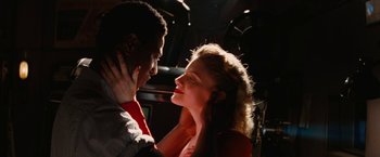 Movie still from “Inglourious Basterds” (2009), directed by Quentin Tarantino – A man and a woman are looking into each others eyes; Close Up shot, Low angle