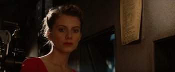 Movie still from “Inglourious Basterds” (2009), directed by Quentin Tarantino – A beautiful young lady in a red top; Close Up shot, Low angle