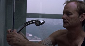 Movie still from “Lost in Translation” (2003), directed by Sofia Coppola – A man in the bathroom is taking a shower; Close Up shot, High angle