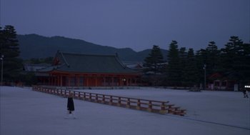 Movie still from “Lost in Translation” (2003), directed by Sofia Coppola – A person standing in the middle of a snow covered field; Extreme Wide shot, High angle