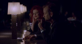 Movie still from “Lost in Translation” (2003), directed by Sofia Coppola – A man and a woman sitting at a bar; Medium shot, Low angle