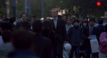 Movie still from “Lost in Translation” (2003), directed by Sofia Coppola – A crowd of people walking down a street; Wide shot, Low angle