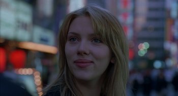 Movie still from “Lost in Translation” (2003), directed by Sofia Coppola – A person with long hair; Close Up shot, Over the shoulder angle