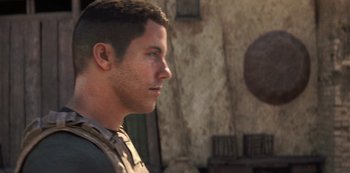 Movie still from “Love, Death & Robots” (2019), created by Tim Miller – A person looking to his left; Close Up shot, Over the shoulder angle