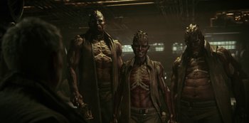 Movie still from “Love, Death & Robots” (2019), created by Tim Miller – A group of men standing next to each other in a dark room; Medium shot, Low angle