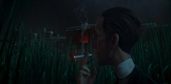 Movie still from “Love, Death & Robots” (2019), created by Tim Miller – A man smoking a cigarette in a field at night; Close Up shot, Over the shoulder angle