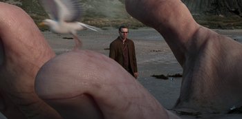 Movie still from “Love, Death & Robots” (2019), created by Tim Miller – A man standing in front of a flock of birds; Extreme Close Up shot, High angle