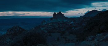 Movie still from “Kingdom of Heaven” (2005), directed by Ridley Scott – A castle on top of a hill at night time; Extreme Wide shot, High angle