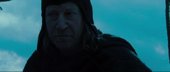 Movie still from “Kingdom of Heaven” (2005), directed by Ridley Scott – A person wearing a hooded jacket; Close Up shot, Low angle