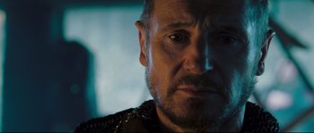 Movie still from “Kingdom of Heaven” (2005), directed by Ridley Scott – A man's face in a dark room; Close Up shot, Over the shoulder angle