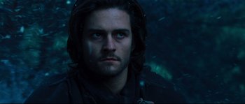 Movie still from “Kingdom of Heaven” (2005), directed by Ridley Scott – A person with long dark hair; Close Up shot, Low angle