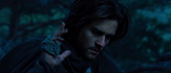 Movie still from “Kingdom of Heaven” (2005), directed by Ridley Scott – A person with long dark hair; Close Up shot, Low angle