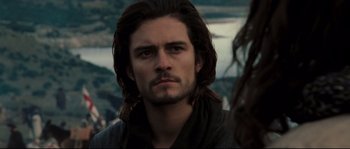 Movie still from “Kingdom of Heaven” (2005), directed by Ridley Scott – A person with long brown hair; Close Up shot, Over the shoulder angle