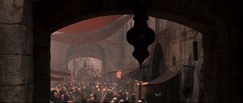 Movie still from “Kingdom of Heaven” (2005), directed by Ridley Scott – A crowd of people walking down a street; Extreme Wide shot, High angle