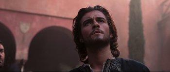 Movie still from “Kingdom of Heaven” (2005), directed by Ridley Scott – A person with long hair; Close Up shot, Low angle