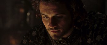 Movie still from “Kingdom of Heaven” (2005), directed by Ridley Scott – A person wearing a chain mail shirt; Close Up shot, High angle