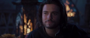Movie still from “Kingdom of Heaven” (2005), directed by Ridley Scott – A person with long dark hair; Close Up shot, Over the shoulder angle