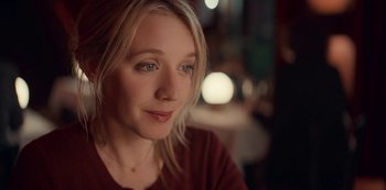 Movie still from “Lupin” (2021), created by Tigran Rosine – A person sitting in a room; Close Up shot, Over the shoulder angle