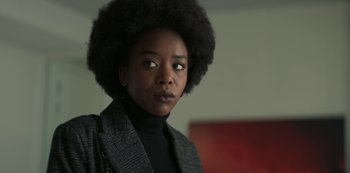 Movie still from “Lupin” (2021), created by Tigran Rosine – A person wearing a jacket; Close Up shot, Over the shoulder angle