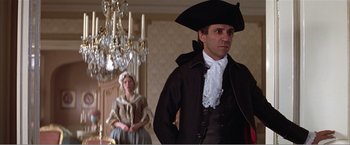 Movie still from “Amadeus” (1984), directed by Milos Forman – A man and a woman dressed in period clothing; Medium shot, Low angle