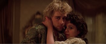 Movie still from “Amadeus” (1984), directed by Milos Forman – A man and a woman embracing each other in front of a mirror; Close Up shot, Low angle