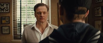 Movie still from “Kingsman: The Secret Service” (2014), directed by Matthew Vaughn – A man looking at himself in the mirror; Close Up shot, Over the shoulder angle