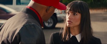 Movie still from “Kingsman: The Secret Service” (2014), directed by Matthew Vaughn – A man and a woman talking to each other; Close Up shot, Over the shoulder angle