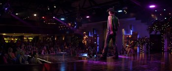 Movie still from “Magic Mike” (2012), directed by Steven Soderbergh – Two men performing on a stage in front of an audience; Wide shot, Over the shoulder angle