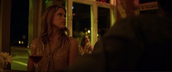 Movie still from “Magic Mike” (2012), directed by Steven Soderbergh – A woman sitting in front of two other women in front of a window; Close Up shot, Over the shoulder angle