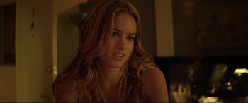 Movie still from “Magic Mike” (2012), directed by Steven Soderbergh – A beautiful young woman with long brown hair and green eyes; Close Up shot, Over the shoulder angle