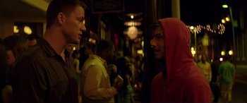 Movie still from “Magic Mike” (2012), directed by Steven Soderbergh – Two men are standing in a crowd of people; Close Up shot, Over the shoulder angle